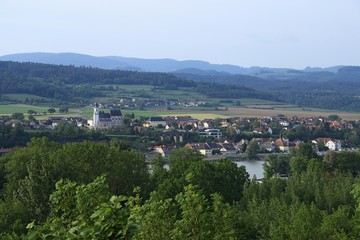Fototapeta na wymiar View from Melk Abbey garden - famous hilltop Benedictine monastery, Austria - to the Emmersdorf town and Donau river