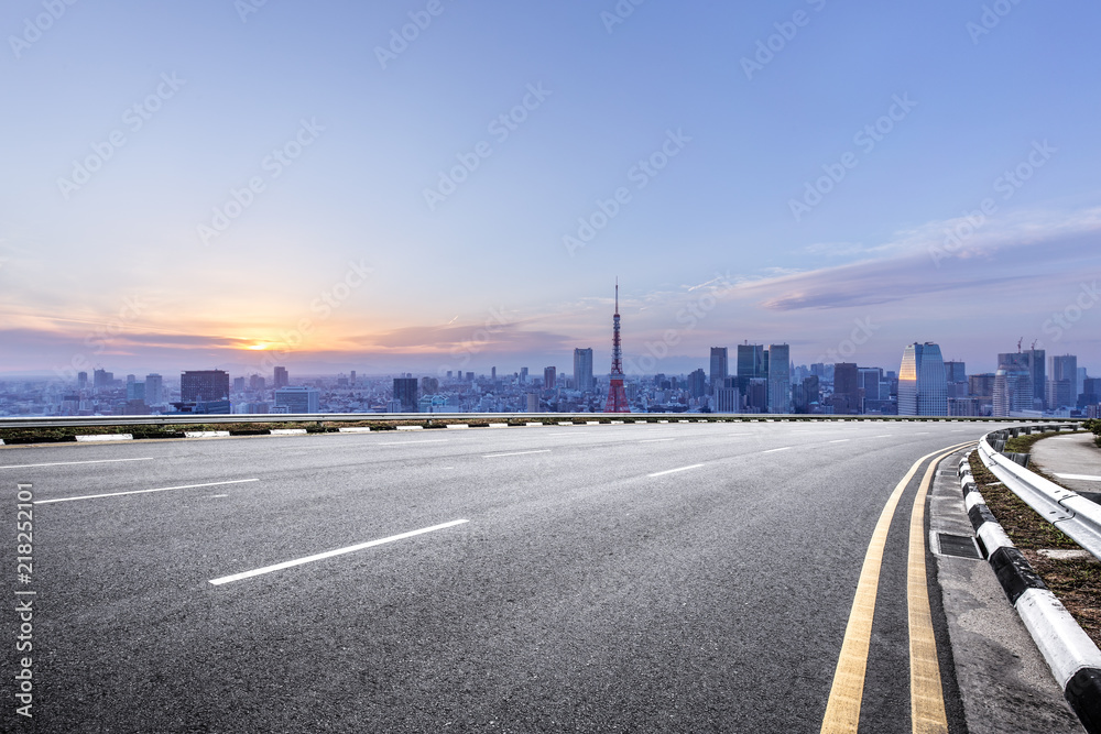 Wall mural empty asphalt road with city skyline in japan - Wall murals