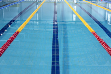 Fototapeta premium Row of starting blocks in a swimming pool