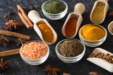 Spices, herbs and food additives on a dark background