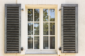 Wooden window with shutters