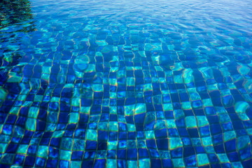 pool water view with blue mosaic ground pattern