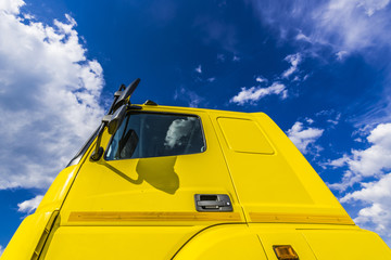 The sky above the yellow truck cab