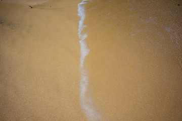 water line at ocean beach sand, holiday concept