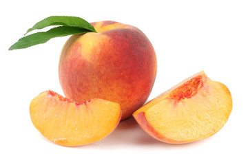 peach fruit with green leaf and slices isolated on white background