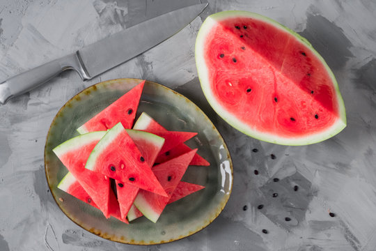 slices of watermelon on a vintage square plate, table setting