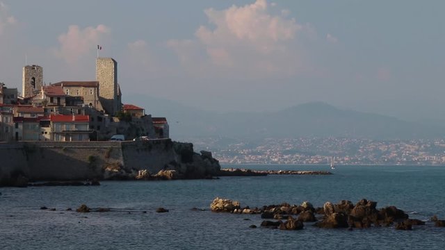 Old Town in Antibes, France, seen from the water, with the tower of the Picasso Museum showing.