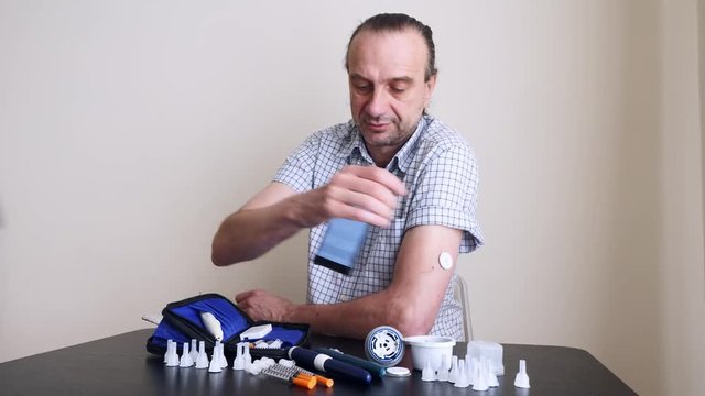 A man hands brings to the hand the smartphone for measuring glucose in the blood