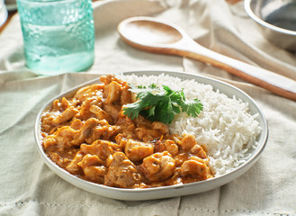 plate of indian curry with basmati rice and chicken