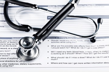 Stethoscope on Health Insurance Document / Medical Form