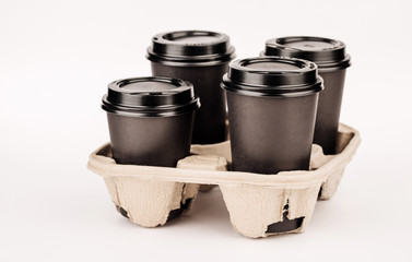 many random paper cups on white background.