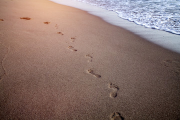 Sandy beach with footprints