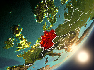 Sun rising above Germany from space