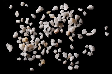 White stone gravel isolated on black background, clipping path, top view