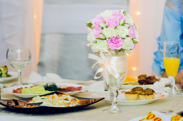 A beautiful bouquet of roses on a festive table.
