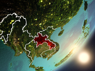 Sun rising above Laos from space