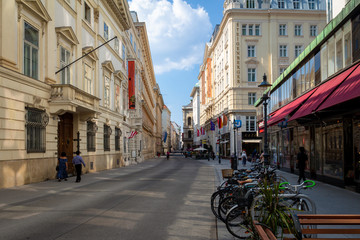 Fototapeta na wymiar Vienna Street - Beautiful building and a coffee shop caught in a quiet side street