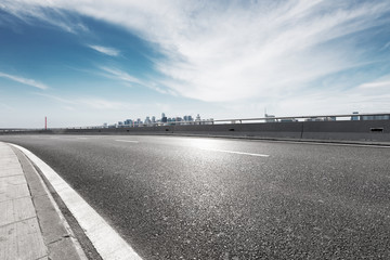 highway through mountain with blue sky