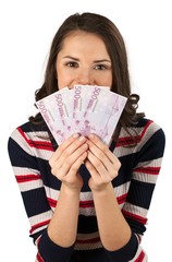 Brunette female holding fanned out cash