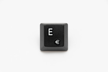 Single black keys of keyboard with different letters E