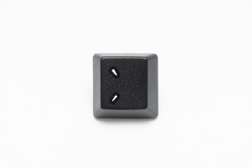 Single black keys of keyboard with different letters colon