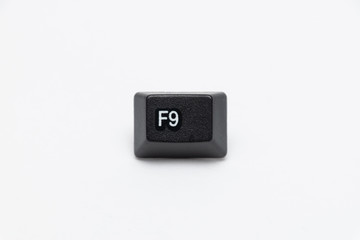 Single black keys of keyboard with different letters F9