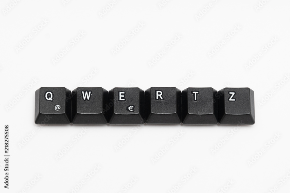 Wall mural single black keys of keyboard with different letters qwertz