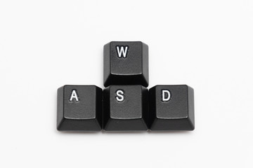 Single black keys of keyboard with different letters WASD
