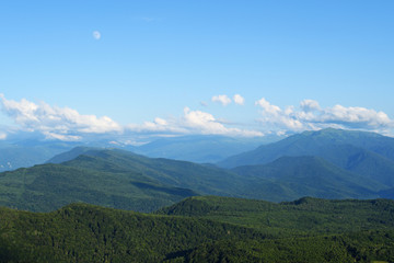 Mountain landscape with clouds and moon