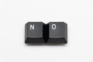 Single black keys of keyboard with different letters NO