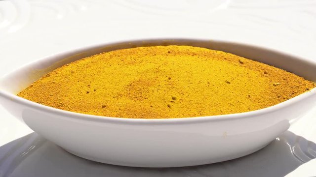 Dry spices curries on a rotary table. 4K. Macroshooting.