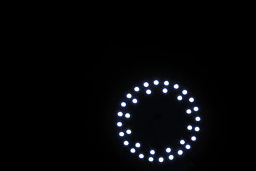 led spotlight aranged in circle on black background