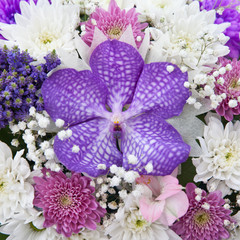 purple Orchid and other flowers in the bouquet
