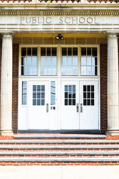 Entrance Doors To A Typical American School Building With Steps Seen From Outside