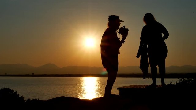 Couple of best friends taking selfie during sunset - Modern concept of friendship with new trends and technology - Travel girlfriends having emotional fun together