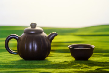 A cup and a kettle of ceramics