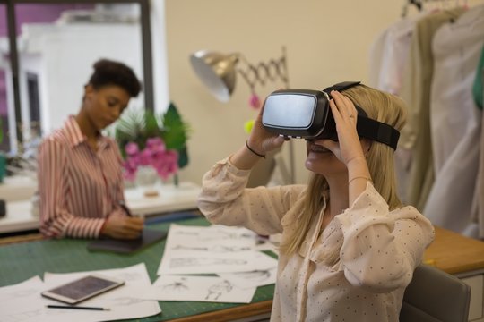 Fashion designer using virtual reality headset