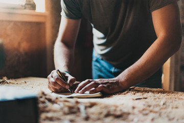 Writer taking notes in his cabin