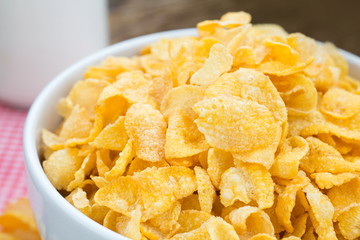 Cornflake cereals on white bowl with close up shot.