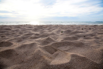 Fototapeta na wymiar Sand beach in the sunset.