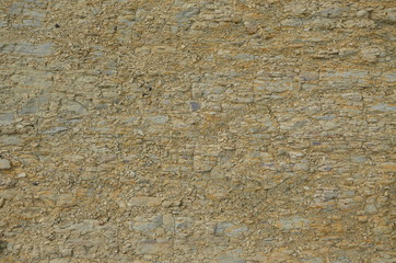Natural rock structure background or texture. Lined rock with different natural colors.