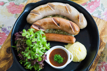 Delicious sausages steak with organic salad
