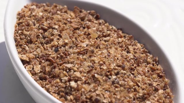 Dry spices mix of salt and pepper on a rotary table. 4K. Macroshooting.