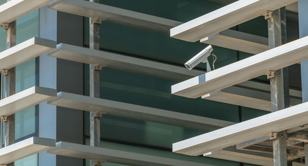 surveillance camera hidden in the facade of a modern building
