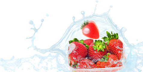 packaged strawberries in water splash