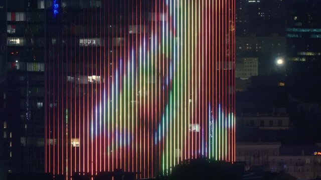Office skyscraper facade with innovation illumination  at night 