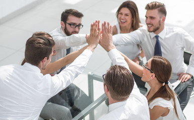Fototapeta na wymiar successful business team giving each other a high five