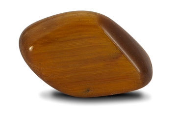 Polished tiger's eye stone isolated on white background