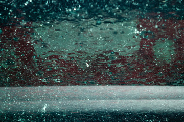 background. defocusing. the windshield of the car in the car wash. beautiful water jets on the glass