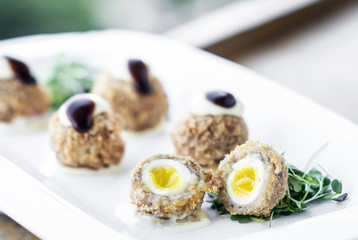 gourmet organic scotch quail eggs starter snack on table